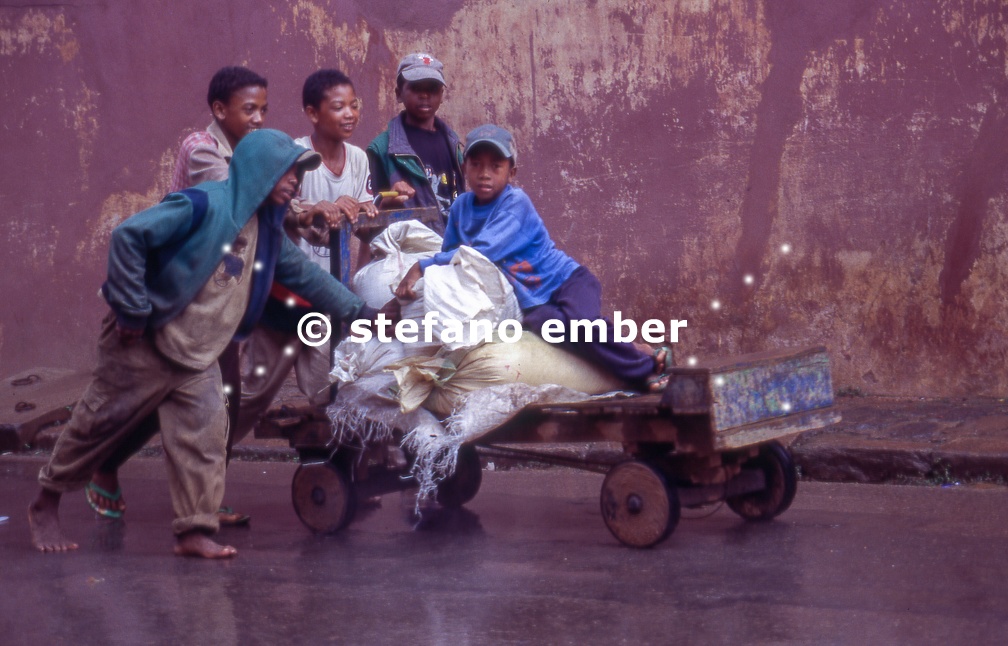 Boys pushing an old cart at Ambositra