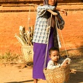 Woman_with_her_son_on_a_basket_at_the_archaeological_site_of_Bagan.jpg