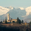 The church of Sant Abbondio at Gentilino in front of the Swiss alps
