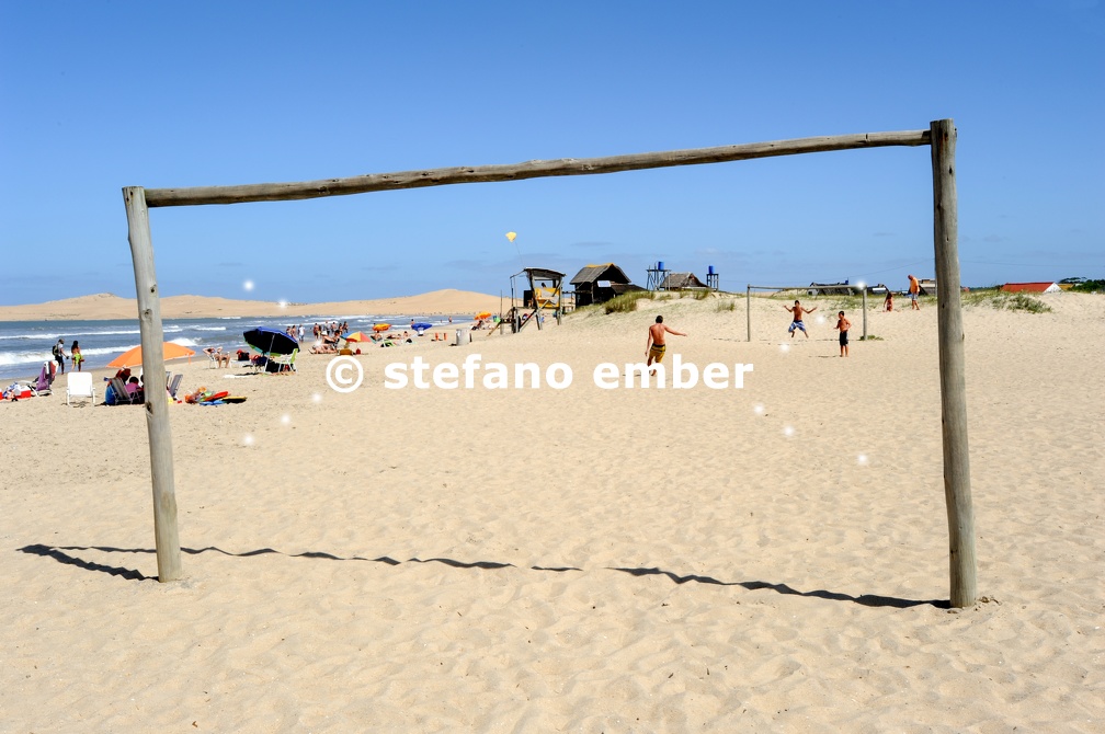 People playing football on the beach of Barra de Valizas