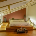 Modern bedroom with African decorations and soft lighting