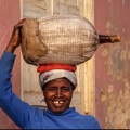 Lady with a bottle of Grogue at Santiago island