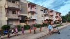 Children waiting in a row to play with an electreic scooter at Vinales