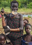 Portrait of Suri tribe woman with her children at Kibish