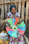 Woman weaving an artwork at Sai