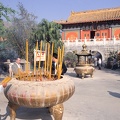 Buddhist believers burn incense in front of Po Lin Monastery 