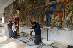 People lighting candles at Bigorski monastery