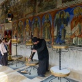 People_lighting_candles_at_Bigorski_monastery.jpg