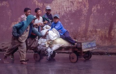 Boys pushing an old cart at Ambositra