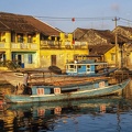Traditional boat in front of ancient architecture in Hoi An